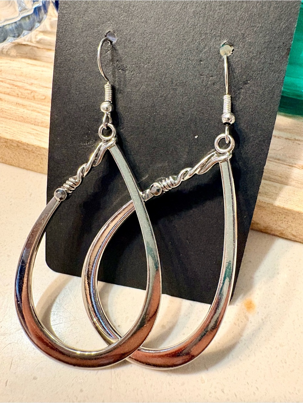 Rhinestone silvertone twist earrings